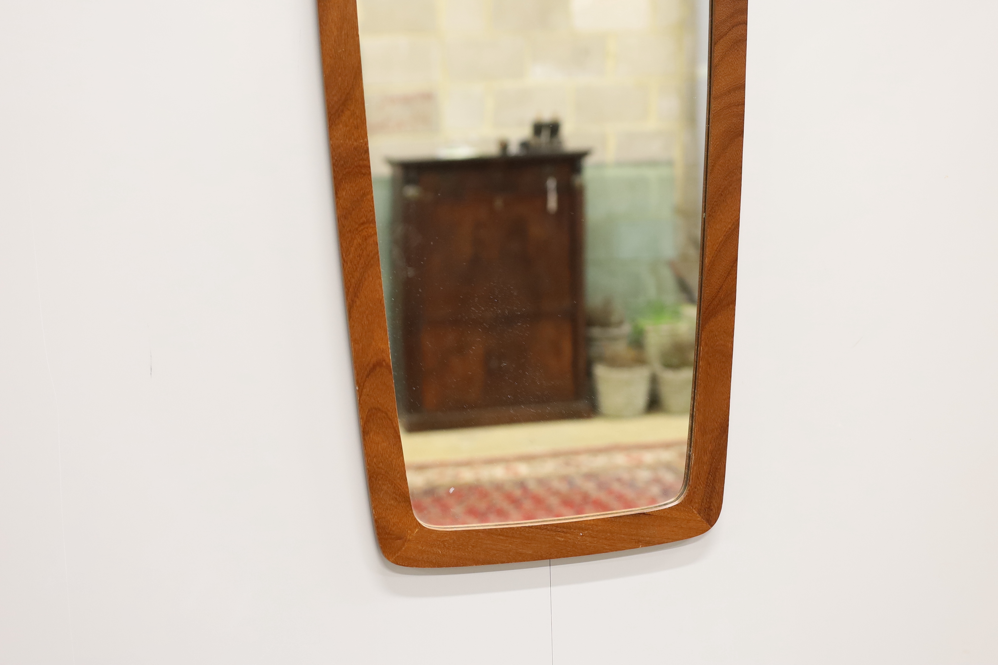 A mid-century teak framed wall mirror, width 36cm, height 76cm